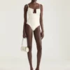 Body con spacchi in maglia con perle ricamate Body con spacchi in maglia con perle ricamate