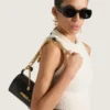 Borsa piccola Pout in pelle con catena Lucky Charms Borsa piccola Pout in pelle con catena Lucky Charms