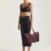 Borsa Snatch grande in pelle martellata Borsa Snatch grande in pelle martellata