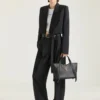 Borsa Snatch media in pelle martellata