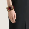 Bracciale rigido scultoreo in metallo e cristalli Bracciale rigido scultoreo in metallo e cristalli