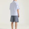 Camicia a righe in cotone con stampa surrealista Camicia a righe in cotone con stampa surrealista