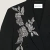 Giacca doppiopetto con spacchi in lana con paillettes Giacca doppiopetto con spacchi in lana con paillettes