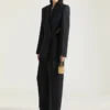 Pantaloni con doppia piega e spacchi in lana Pantaloni con doppia piega e spacchi in lana