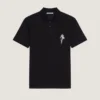 Polo in cotone con ricamo in cristallo