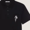 Polo in cotone con ricamo in cristallo